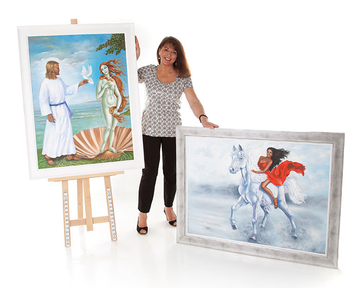 Rita Cherry showing her paintings